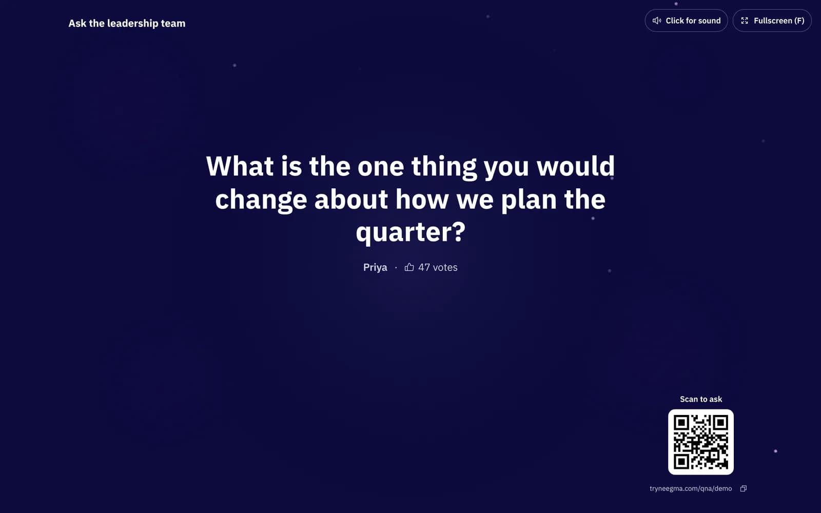 The Q&A big screen showing the question being answered with its asker and 47 votes, and a Scan to ask QR code in the corner